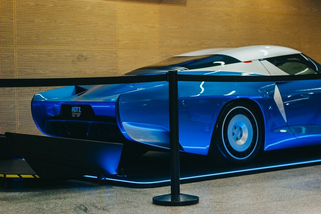 Hypercar showcased on a rotating platform at an evening exhibition