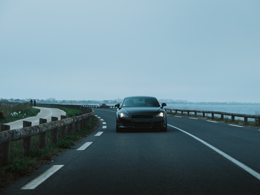 luxury car on coastal road