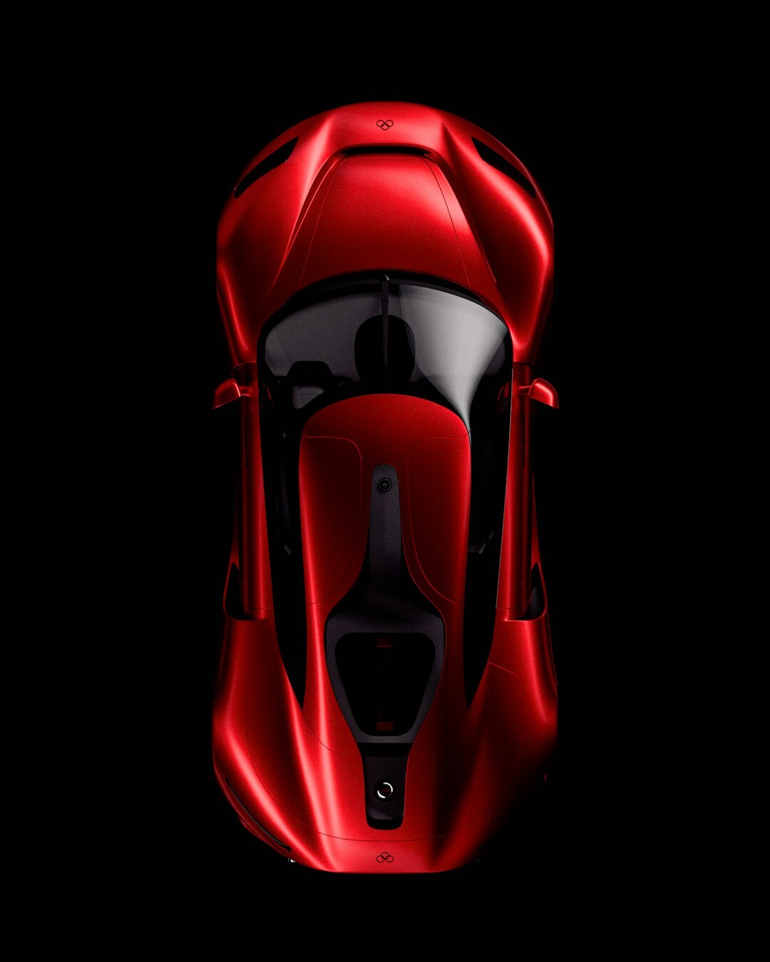 Modern hypercar with aggressive aerodynamics photographed on a dark studio stage