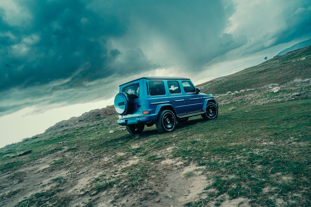 luxury suv on mountain road