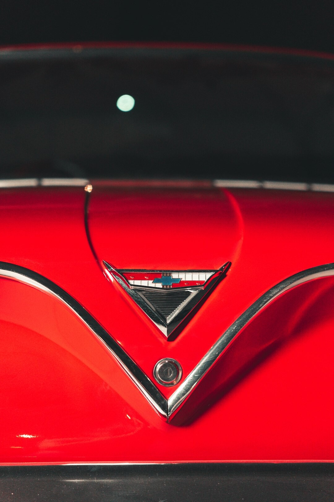 Restored 1930s roadster with elegant chrome details photographed in a studio