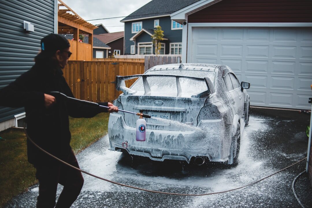 person washing car